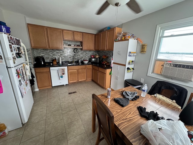 kitchen with tasteful backsplash, sink, light tile patterned floors, ceiling fan, and white appliances