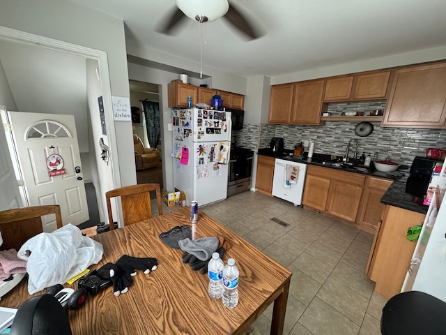 kitchen with sink, white appliances, light tile patterned floors, ceiling fan, and backsplash