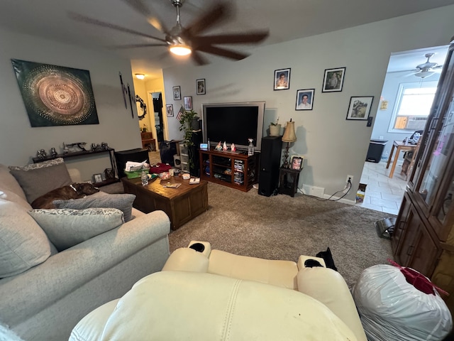 living room with carpet flooring and ceiling fan