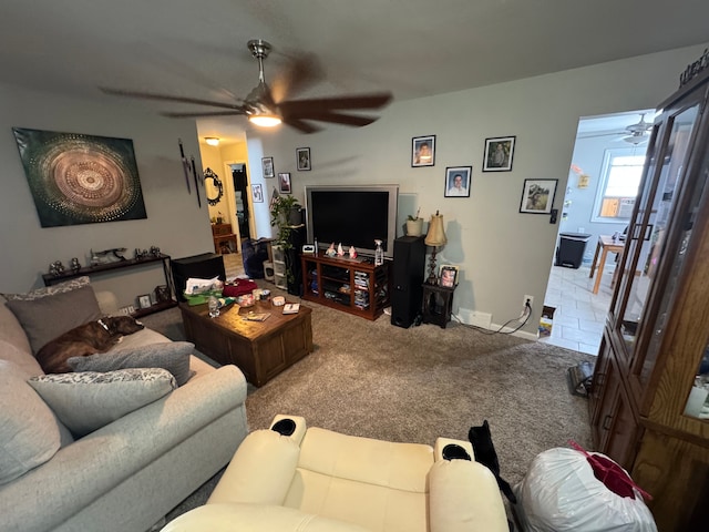 living room with ceiling fan and light carpet