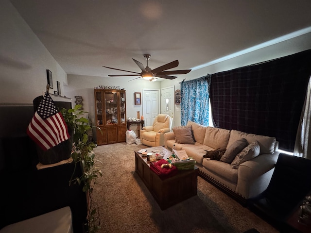 living room with ceiling fan and carpet