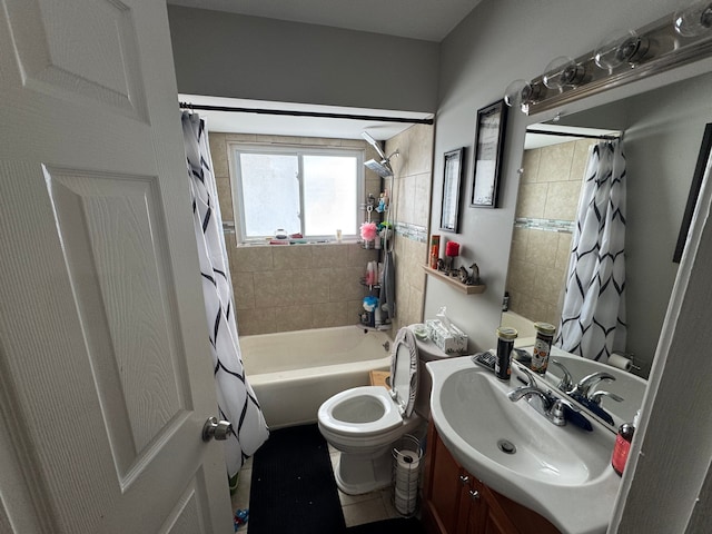 full bathroom featuring shower / tub combo with curtain, vanity, and toilet