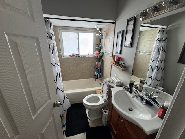 full bathroom featuring vanity, shower / bath combination with curtain, and toilet