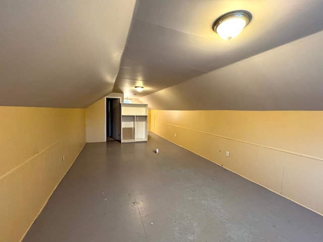 additional living space featuring vaulted ceiling