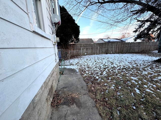 view of yard layered in snow