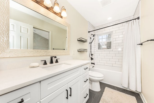 full bathroom with vanity, shower / tub combo, and toilet