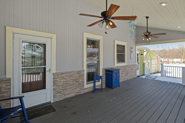 wooden terrace featuring ceiling fan