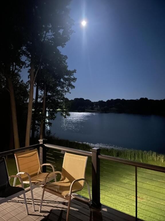 wooden deck with a water view