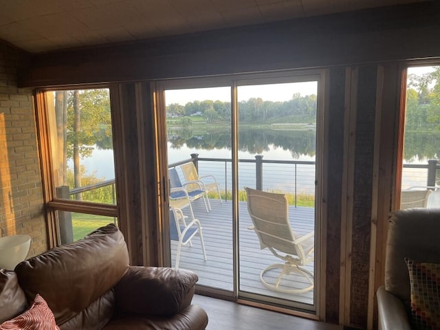 doorway featuring a water view and hardwood / wood-style floors