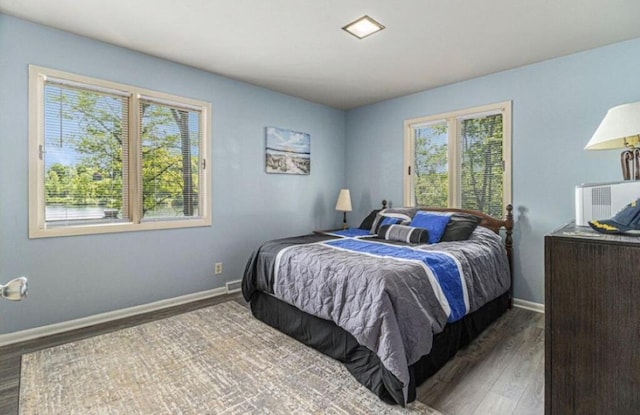 bedroom featuring dark hardwood / wood-style flooring