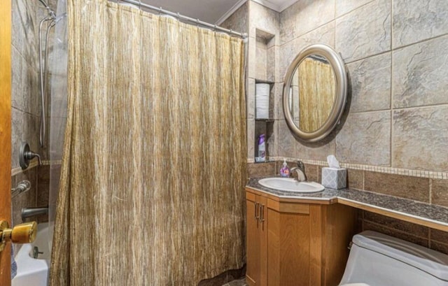 full bathroom featuring vanity, shower / bath combo, and toilet