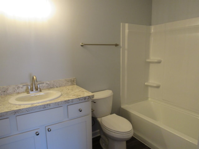 full bathroom featuring shower / tub combination, vanity, and toilet