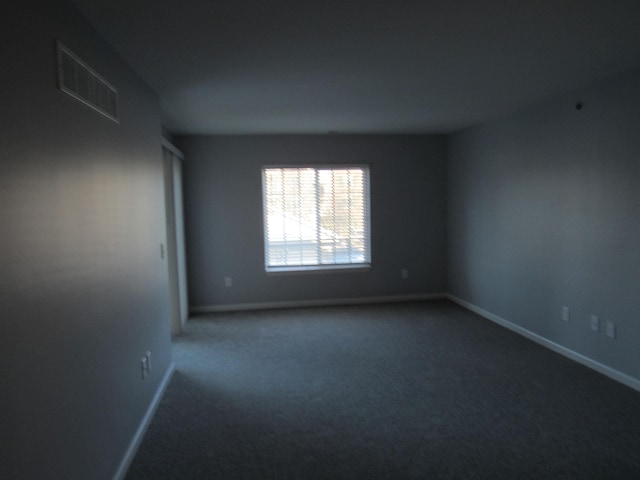 unfurnished room with carpet floors