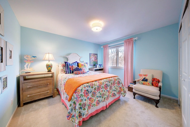 bedroom with carpet flooring and a closet