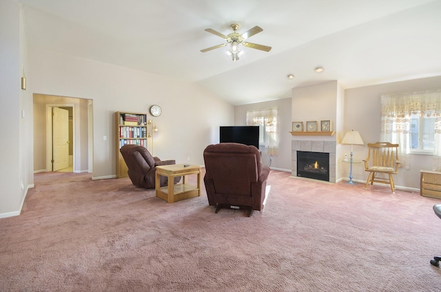 living room featuring carpet flooring, a fireplace, vaulted ceiling, and a wealth of natural light