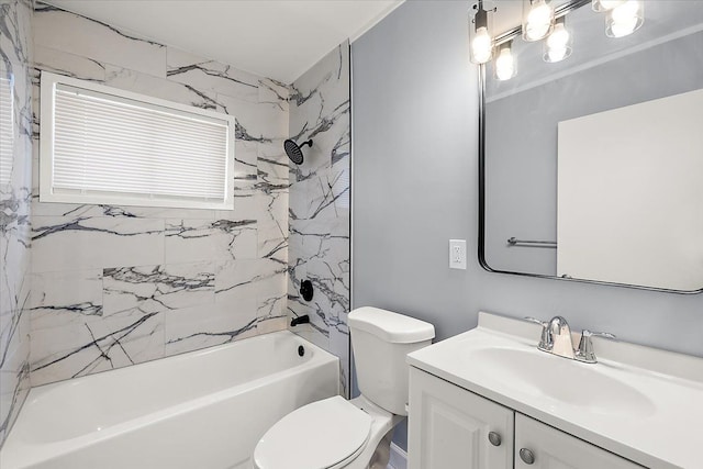 full bathroom featuring tiled shower / bath combo, vanity, and toilet