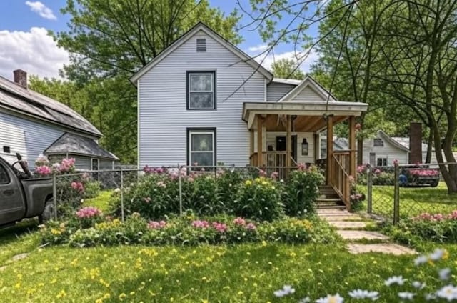 135 Fair St SE, Grand Rapids, MI 49507 - rear view of house with a porch