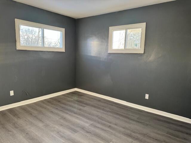 unfurnished room featuring hardwood / wood-style flooring