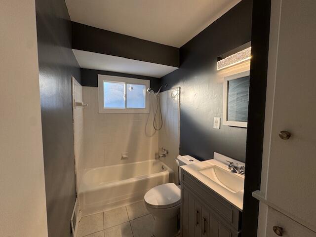 full bathroom featuring vanity, toilet, tile patterned floors, and shower / bathing tub combination