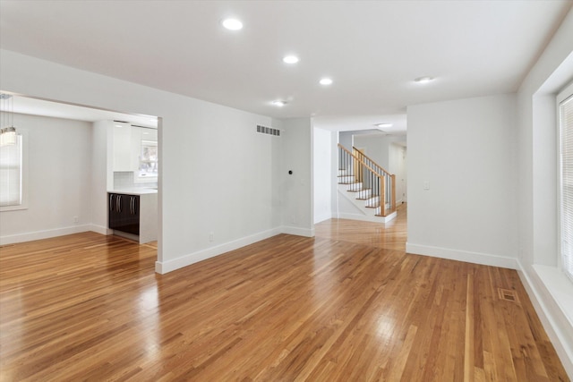 unfurnished room featuring light wood-type flooring