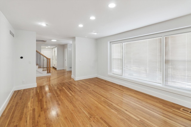 unfurnished living room featuring light wood-type flooring