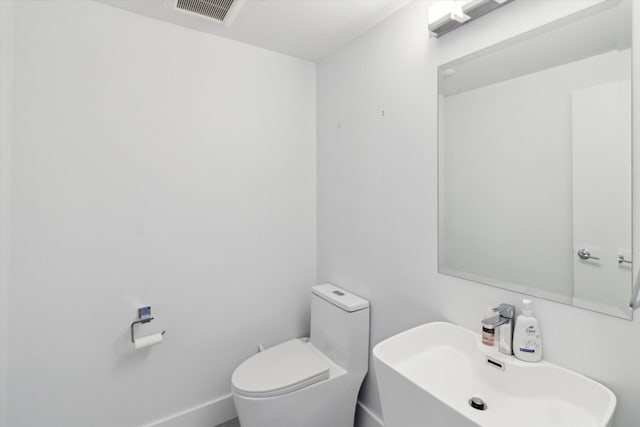 bathroom with sink and toilet