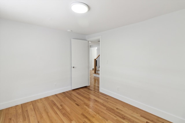 spare room with light hardwood / wood-style floors