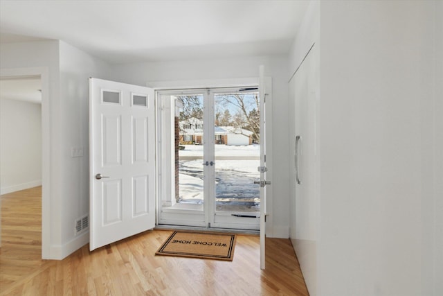 doorway to outside featuring light hardwood / wood-style flooring