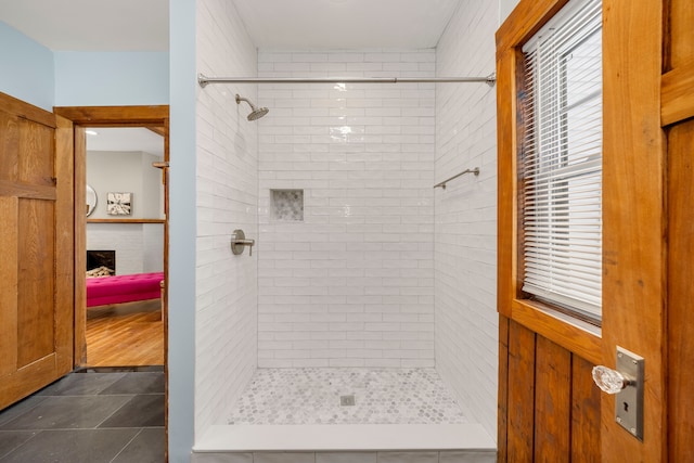 bathroom featuring tiled shower