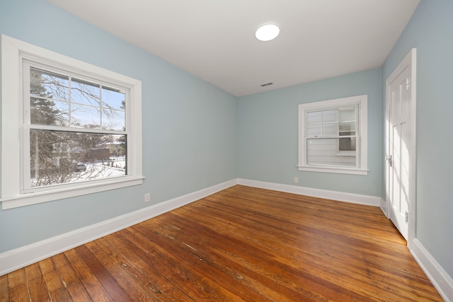 spare room featuring hardwood / wood-style floors