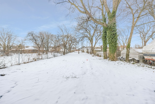 view of yard layered in snow