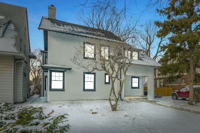 view of snow covered house