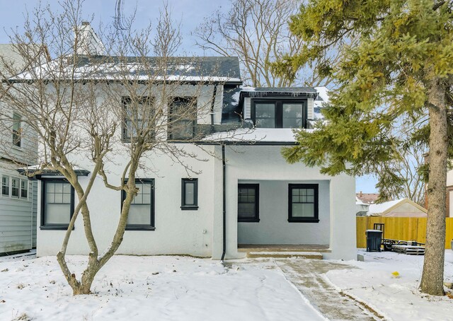 view of snow covered house