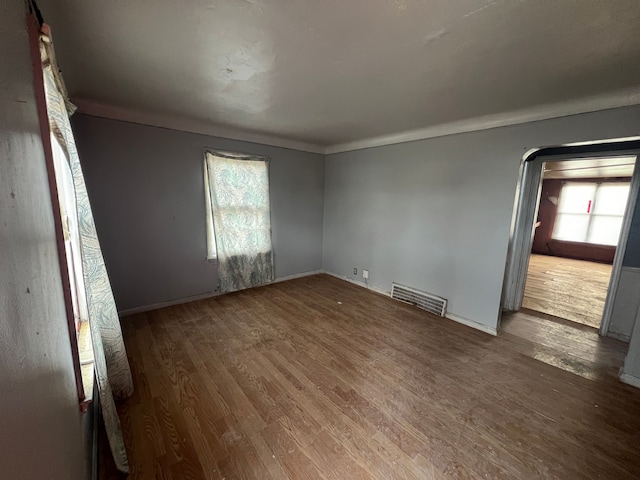 empty room with hardwood / wood-style floors