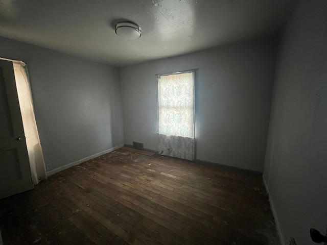 empty room featuring dark hardwood / wood-style floors