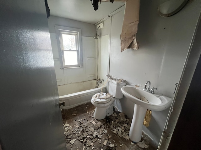 bathroom featuring tub / shower combination and toilet