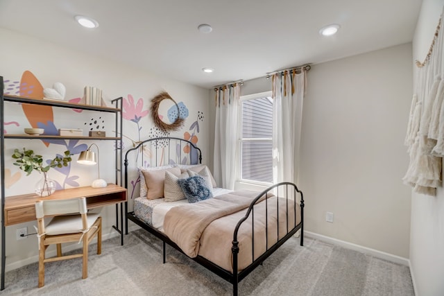 bedroom with baseboards, recessed lighting, and light colored carpet