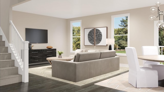 living room with hardwood / wood-style floors and a notable chandelier