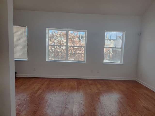 spare room with hardwood / wood-style floors