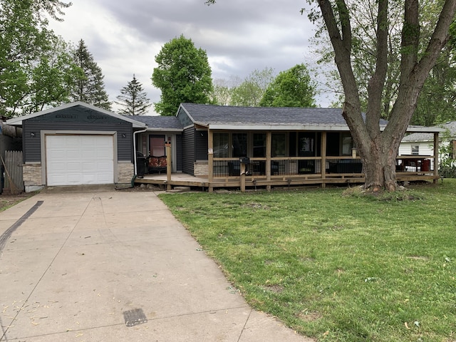 ranch-style house with a garage and a front lawn