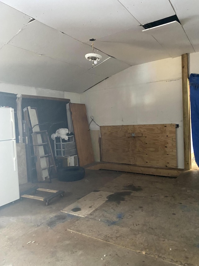 garage with white fridge