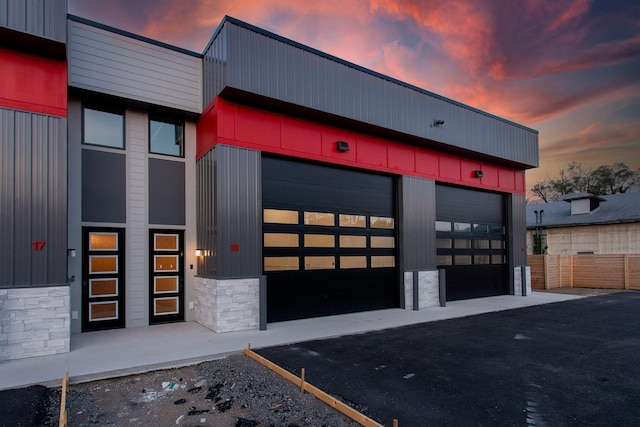 view of outdoor building at dusk