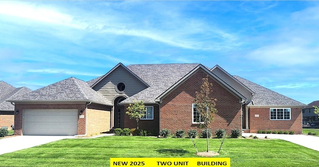 view of front of property with a garage and a front yard