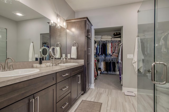 bathroom with vanity and an enclosed shower