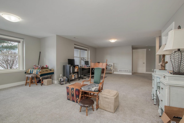 living room with light colored carpet