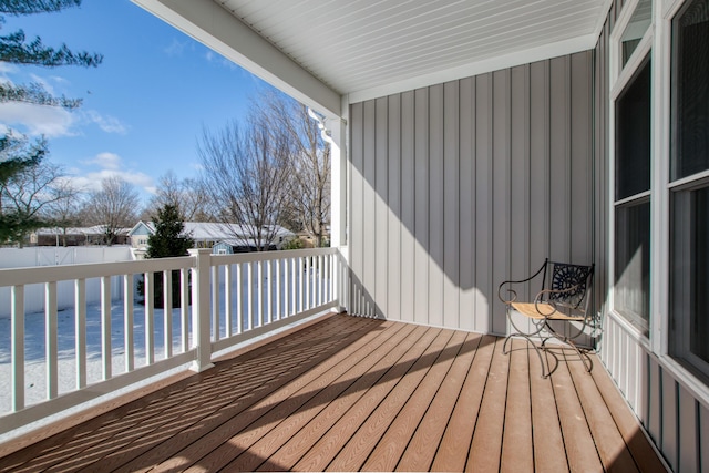 wooden terrace featuring a water view