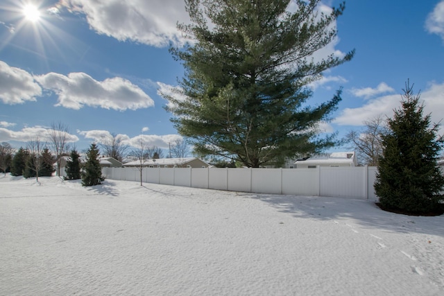 view of yard layered in snow