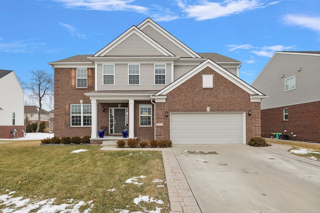 view of front of house featuring a garage and a front yard