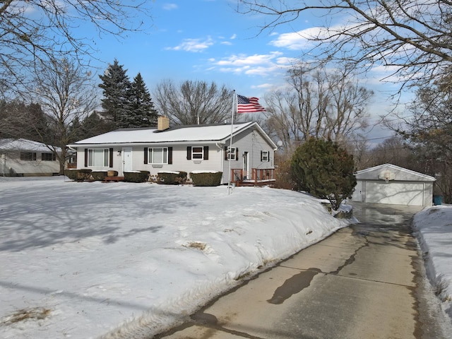 view of front of home featuring an outbuilding and a garage