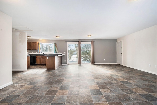 unfurnished living room featuring sink